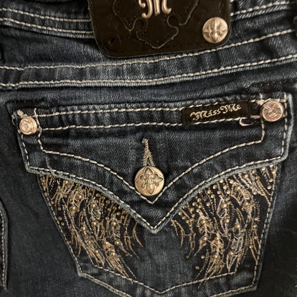MissMe Boot cut Jean with beautiful detailed design around back pockets